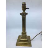 A brass continental column table lamp