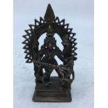 A late 19th/early 20th century Indian bronze figure of four armed Durga, height 11.8cm.