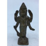 A small 20th century Indian bronze figure of a four armed deity, height 7.5cm.