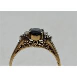 An 14ct. gold, diamond and sapphire ring, (ESW approx. 0.60 carats), (gross weight 2.0g). Size: UK