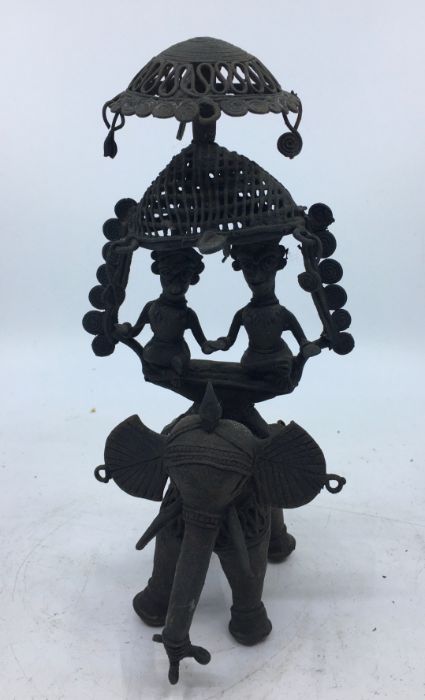 A 20th century Indian bronze figural of an elephant with newley weds, height 22cm.