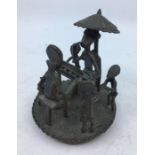 A 20th century African bronze vessel cover with figural group to top, height 11cm.