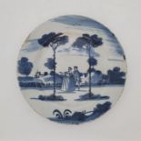 An 18th century English Delftware plate, painted in blue, diameter 23cm. Condition note: loss of