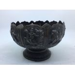 A late 19th/early 20th century Indian white metal pedestal bowl, having eight repousse panels to