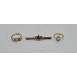 An 18ct. gold, opal and diamond ring, set three graduated oval cabochon opals with pairs of old-