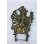 A 20th century Indian bronze figure of ten armed Kali, base lacking, with traces of gilt