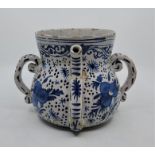 A late 17th/early 18th century English Delftware posset pot, painted in blue, lacking cover, base