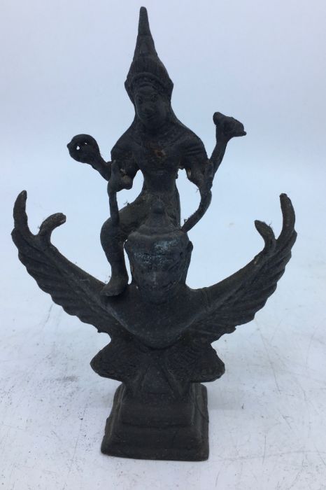 A 20th century Indian bronze figure of Vishnu riding upon Garuda, height 16.5cm.