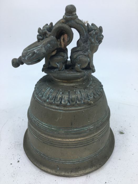 An early 20th century Sino-Tibetan bronze bell, lacking clapper, height 19cm. - Image 2 of 3