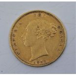 A Victorian 1877 "Young bust" half sovereign gold coin, rev. shield, die no.103.