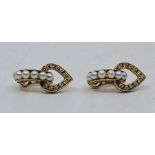 A pair of 18ct. gold, diamond and cultured pearl half hoop clip earrings, each having half hoop