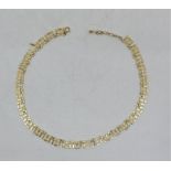 A 9ct. gold fancy link necklace, length 43.5cm. (12.9g) Condition note: one link as found.