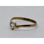 An 18ct. gold and aquamarine ring, three claw set heart cut aquamarine. (gross weight 1.2g). Size UK