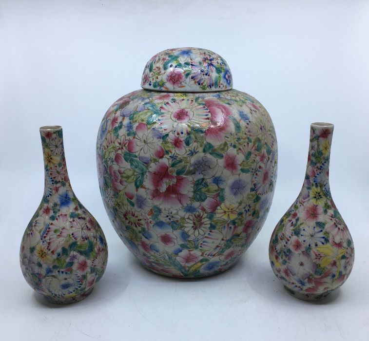 An early 20th century Chinese porcelain garniture Millefleur pattern ginger jar and cover together