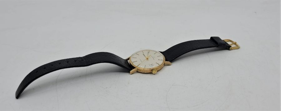 A Garrard 9ct. gold gentleman's quartz wrist watch, c.1984, having signed circular silvered dial - Image 5 of 6