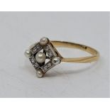 An Art Deco precious yellow metal, diamond and pearl ring, set central cultured pearl with border