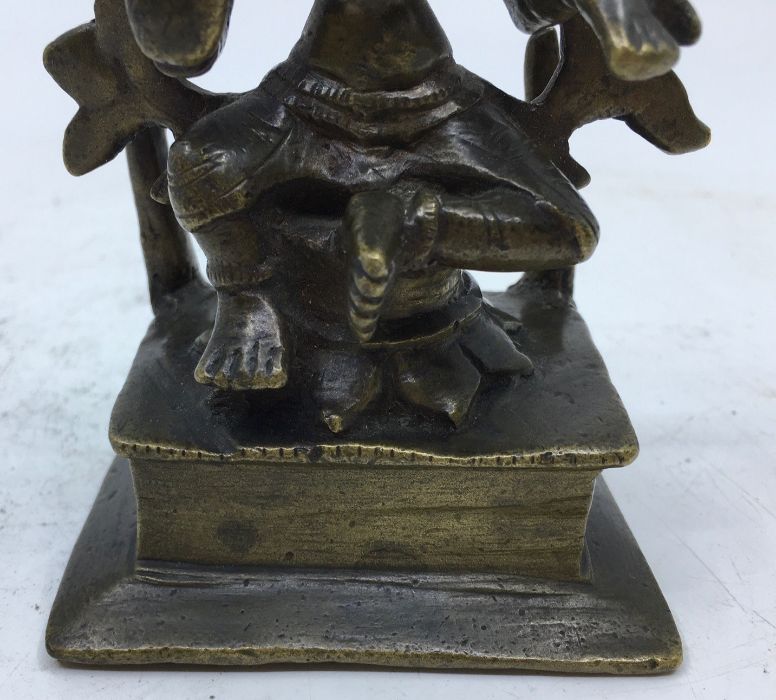 An 18th/19th century Indian bronze figure of a four armed deity, height 12cm. - Image 3 of 5