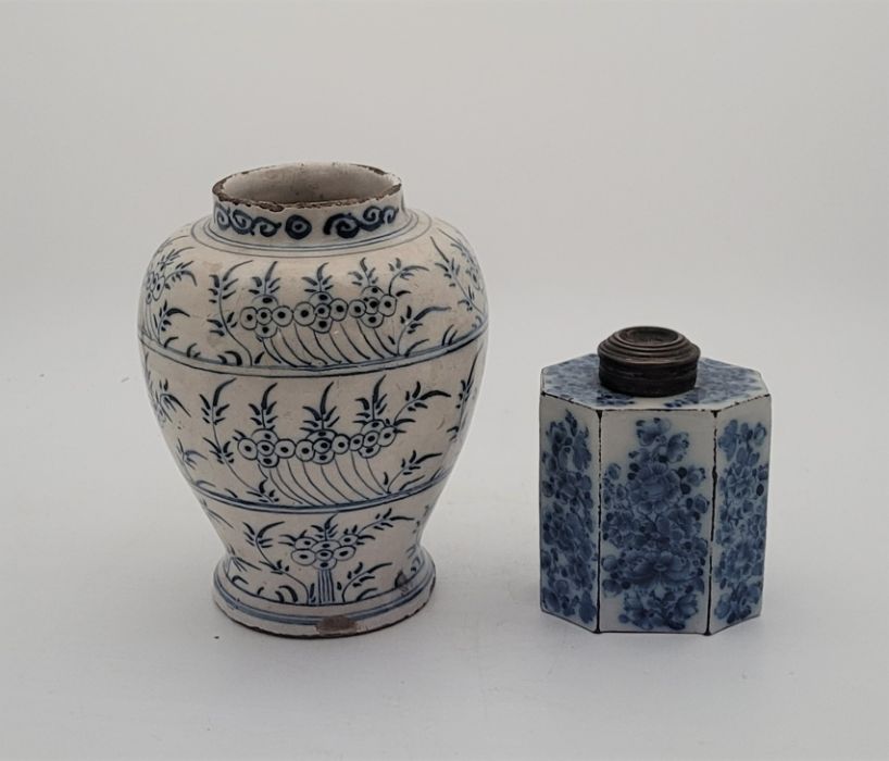 An 18th century English Delftware tea cannister, painted in blue, with associated later metal cover,