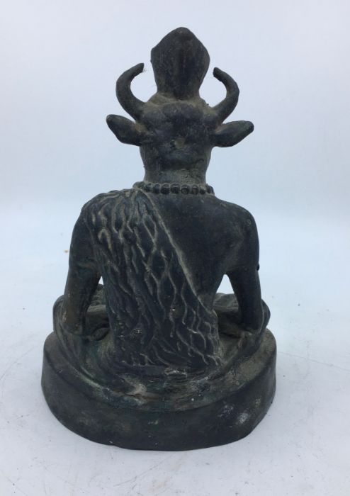 A 20th century Indian bronze figure of a seated deity, height 20cm. - Image 4 of 5