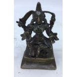 An 18th/19th century Indian bronze figure of a four armed deity, height 12cm.