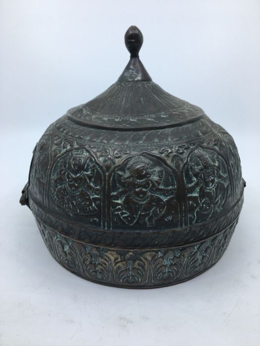 A 20th century Indian hinged hat box, fashioned as a helmet, the sides repousse various deities, - Image 2 of 3