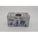 A mid 18th century Bristol Delftware flower brick, painted in blue, length 14.2cm. Condition note: