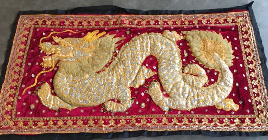 A Chinese Republican period embroidered wall hanging of a dragon, 78cm X 149cm.