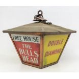 Advertising: An early to mid 20th century, outside wall hanging vintage lamp from 'The Bulls