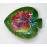 A Moorcroft Hibiscus pattern club shaped pin dish, 13.7cm x 11.8cm, with Queen Mary label