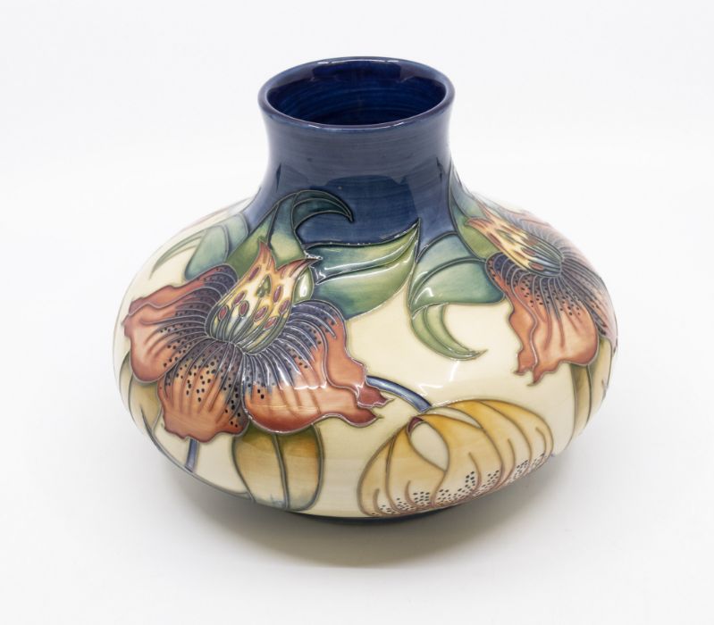 Moorcroft Pottery, a compressed baluster vase decorated in 'Anna Lily' pattern. Height approx 16. - Image 2 of 3