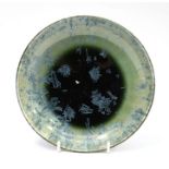 An Arthur Wedgwood Art pottery crystalline shallow dish decorated in green and blue glazes  Date: