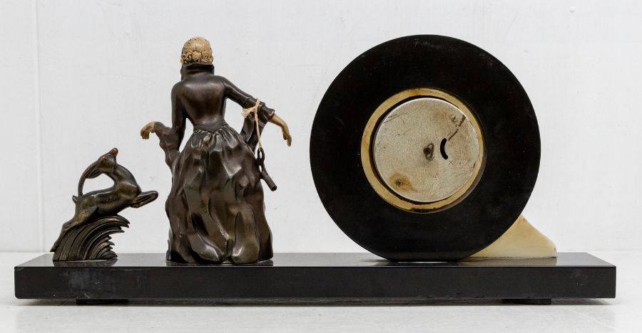 An Art Deco style clock garniture of circular marble design with spelter figure of a female and a - Image 2 of 2