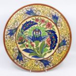 A Charlotte Rhead for Burleighware - a Persian design charger with tube lined decoration, factory