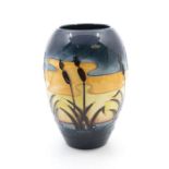 Moorcroft Pottery 'Reeds at Sunset' pattern ovoid vase. Height approx 18cm. No signs of damage.