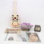 A small lot of The Beatles Vintage memorabilia including a toy guitar ( no strings ) and some