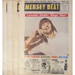 A collection of The Beatles posters. A set of 4 x Mersey Beat reproduction posters each approx 24