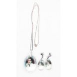 ELVIS PRESLEY  A set including a Pendant and a pair of Earrings. Elvis crystal pendants on