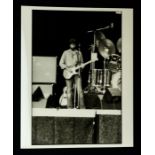 ERIC CLAPTON - Original 10 x 8 black and white photograph - full length image of Eric on stage