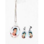 ELVIS PRESLEY  A set including a Pendant and a pair of Earrings. Elvis crystal pendants on