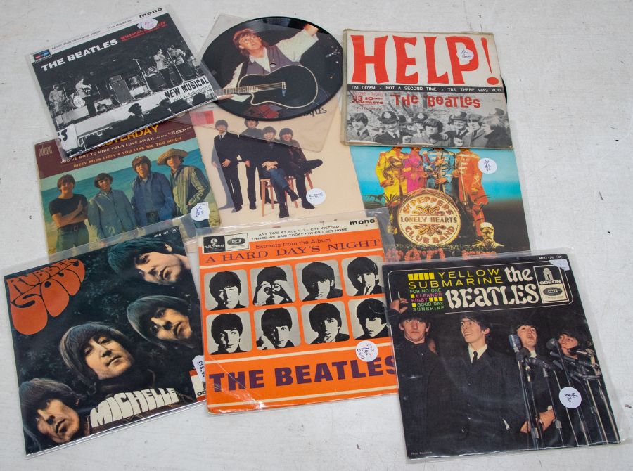 A collection of The Beatles and related and solo 7 inch 45 and EPs vinyl records to include Julian