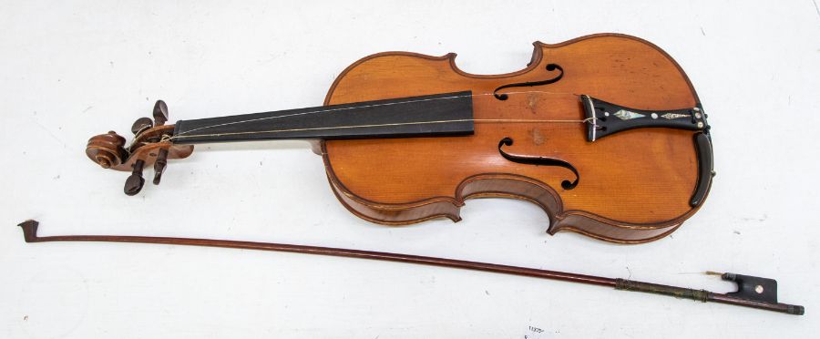 A Violin with facsimile Stradivarius label, the two-piece back of medium curl descending from the