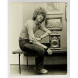 DAVID BOWIE - Original 8.5 x 6.5 black and white photograph of David leaning against a mantle clock.