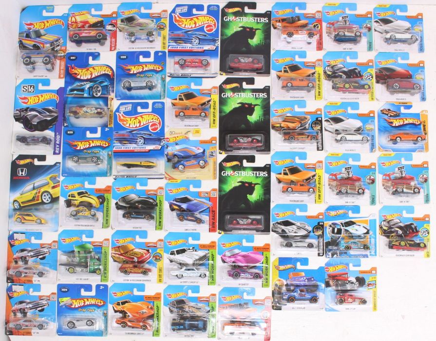 Hot Wheels: A collection of assorted Hot Wheels carded vehicles to include: HW Workshop, Drop