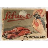 Schuco: A boxed Schuco Telesteering Car 3000. Tinplate clockwork car in very good original condition