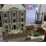 Dolls House: A late 20th century dolls house, three-storey with front staircase and garden