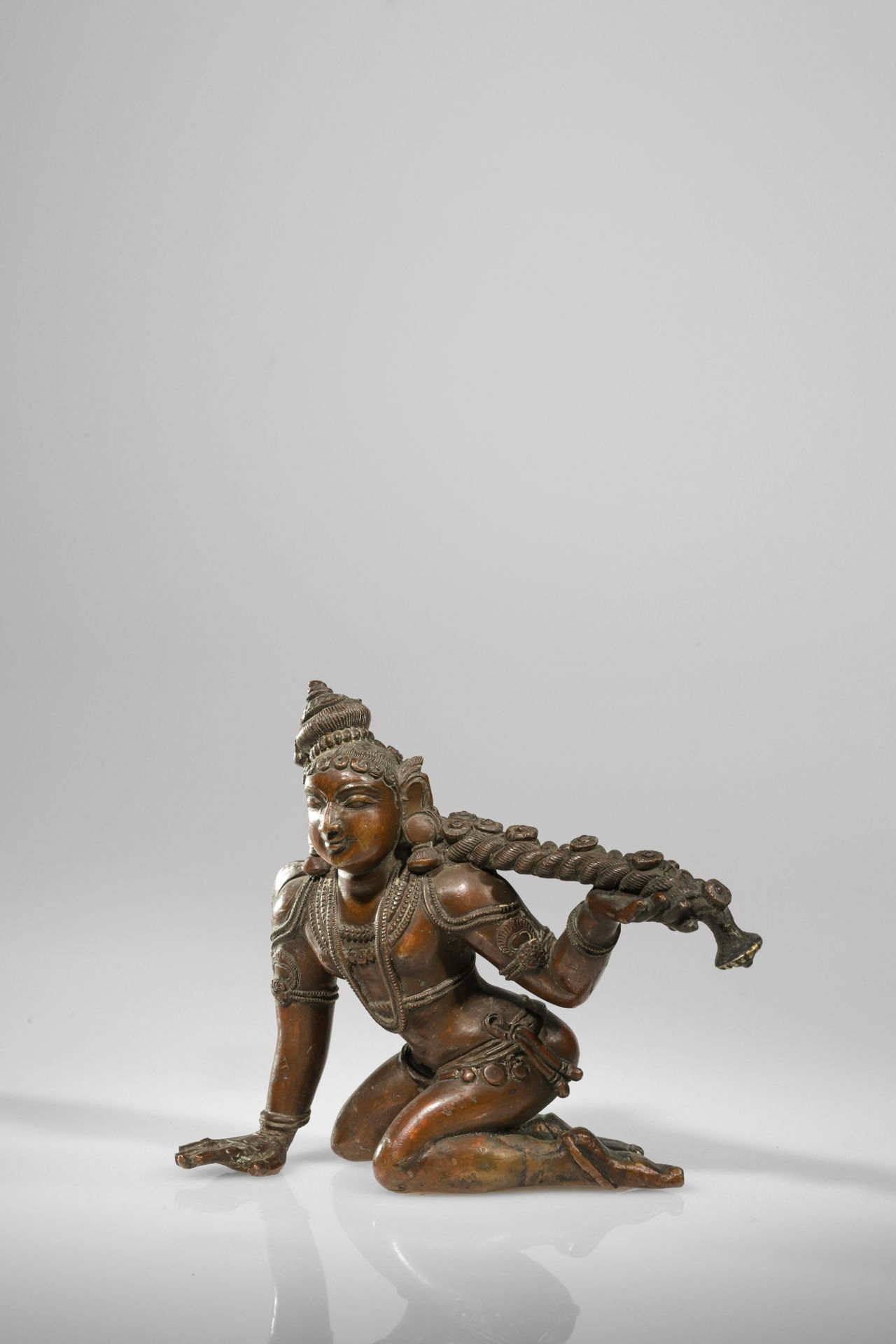 KRISHNA PLAYING WITH HIS HAIR