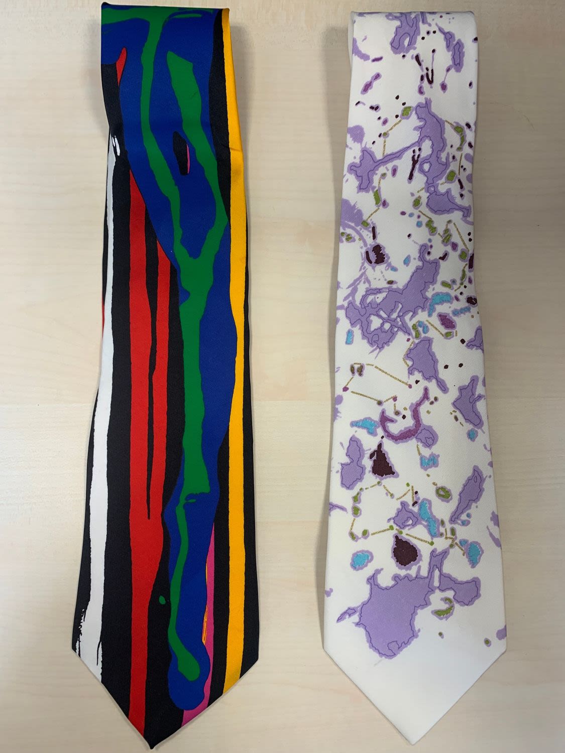 2 'Cultural Ties' ties by Teresita Dennis & one other