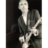 Mick Jones/The Clash photograph, Felix Bloomfield marked on reverse. Plus two other reprints,