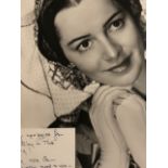 Olivia De Havilland photograph, noted paper attached bearing signature. Plus a photograph of Joan