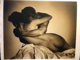 John Swannell photograph of embracing couple. Sepia tint on Matt paper. Studio stamp on reverse